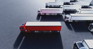 Fleet of new heavy trucks with one selected. Transportation