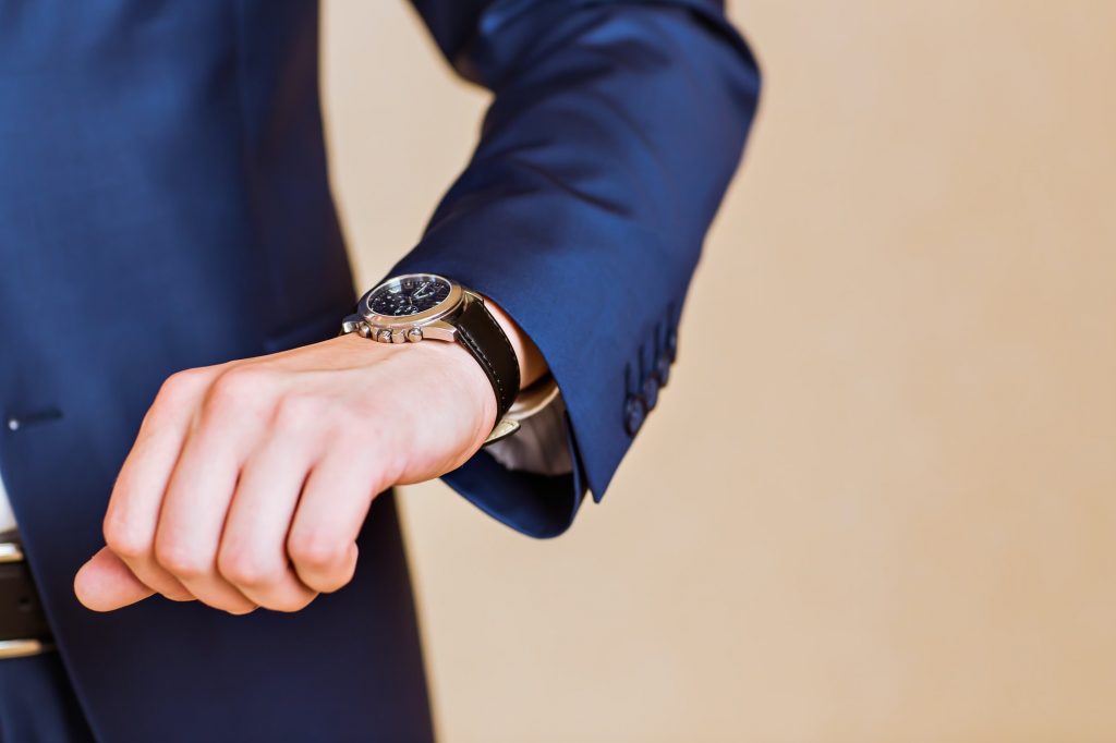 men's hand with a watch.