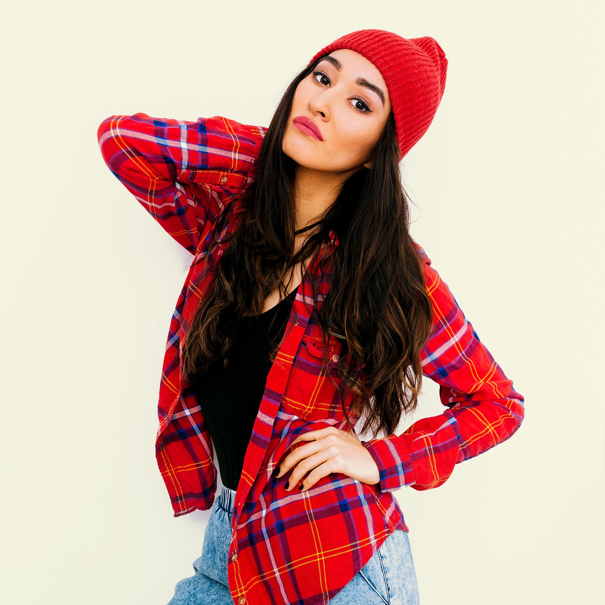 Pretty brunette Girl. Urban Fashion Look. Checkered shirt and b