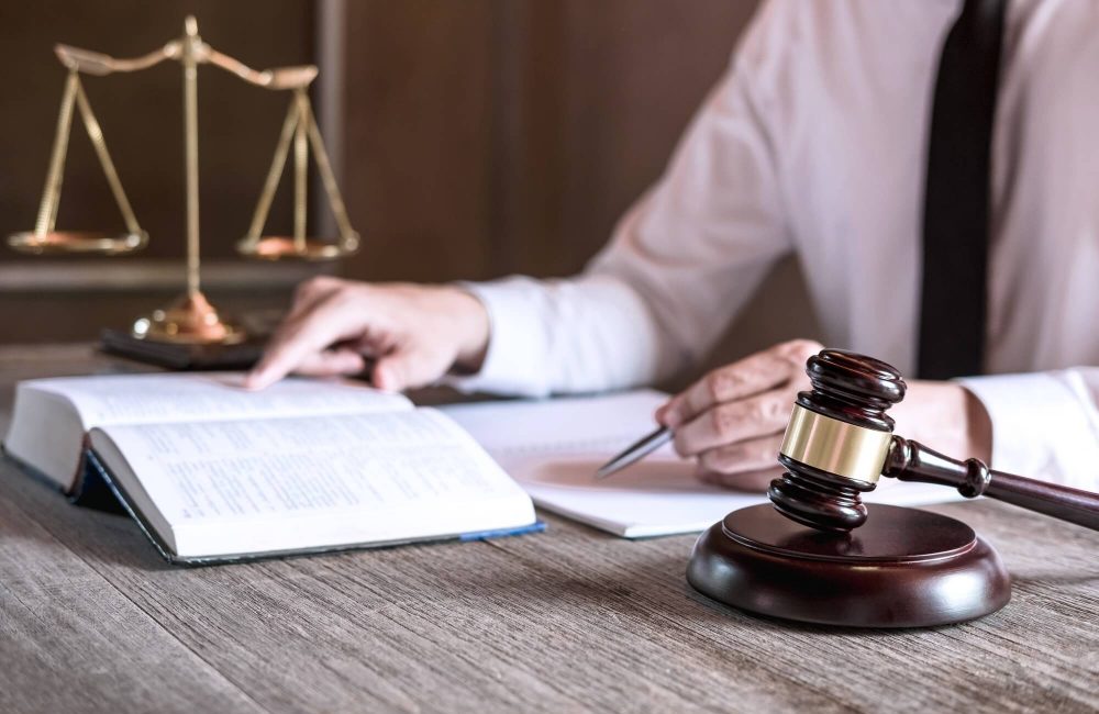 male-lawyer-or-judge-working-with-law-books